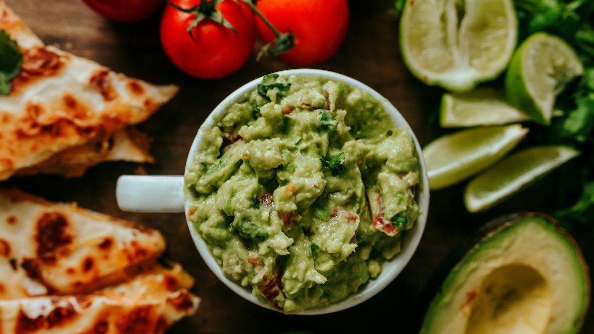 A Mexican-style taco spread alongside a bottle of olive oil