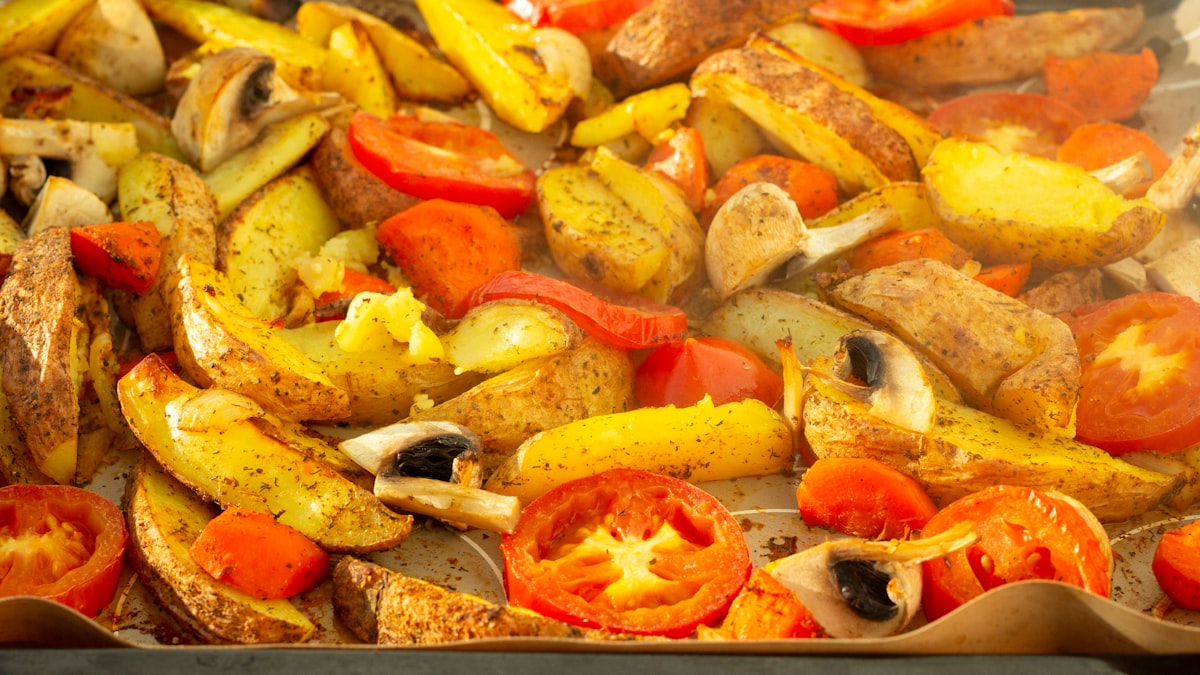 A pan of olive oil roasted vegetables fresh from the oven